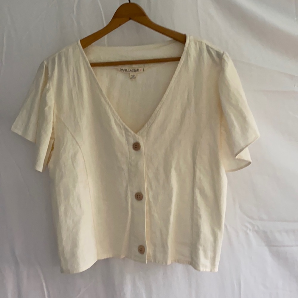 Cream top with tan buttons
